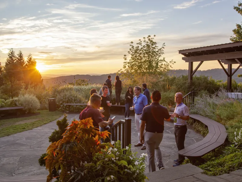 Corporate gathering in the Garden Patio during sunset. 