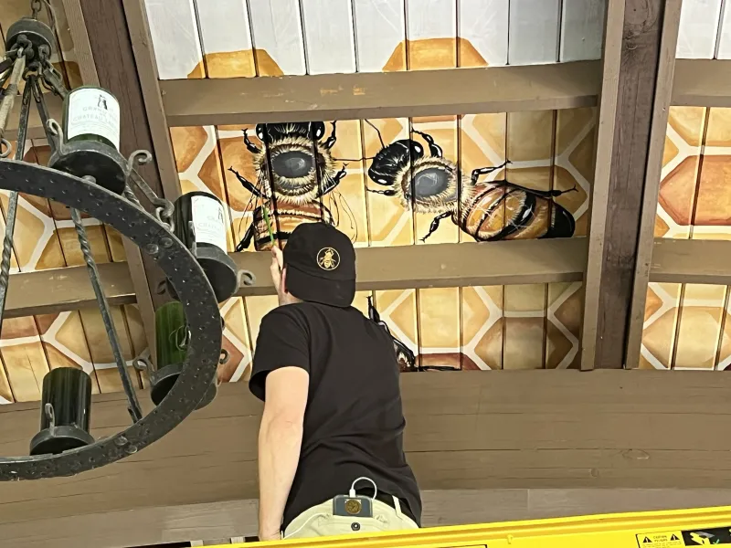 Matt Wiley painting mural