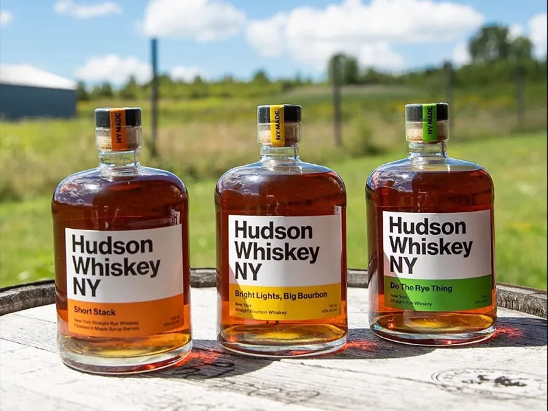 Three Hudson Whiskey bottles.