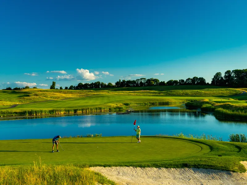 Two golfers standing on Ballyowen Golf Course. 