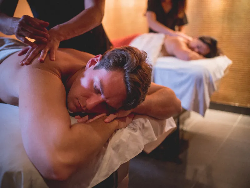 Two people getting massaged at Reflection Spa.