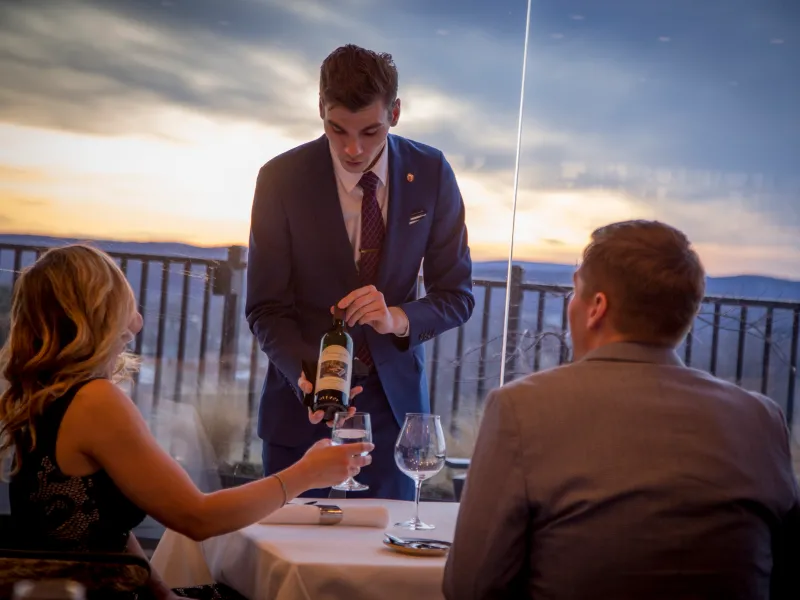 Sommelier serving wine