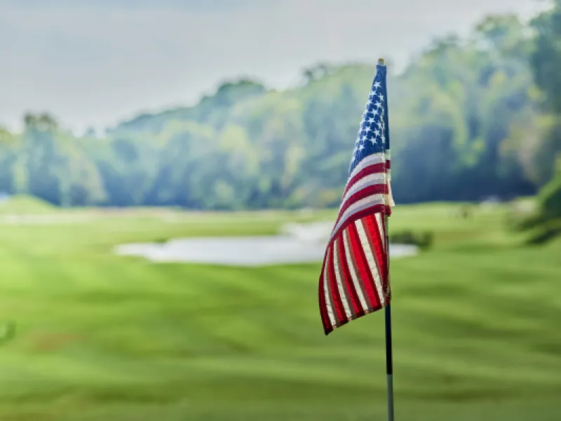 american flag flying on golf course
