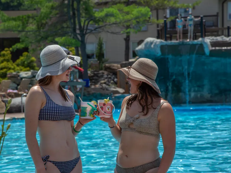 Girlfriends enjoying rum buckets at Minerals Pool
