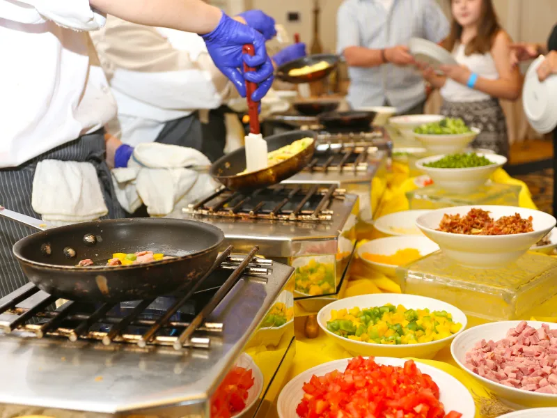 Chef cooking at omelette station during Mother's Day brunch buffet