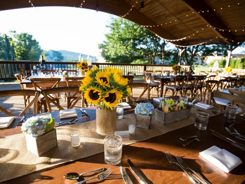 Sweetgrass Pavillion wedding set up with sunflower centerpieces