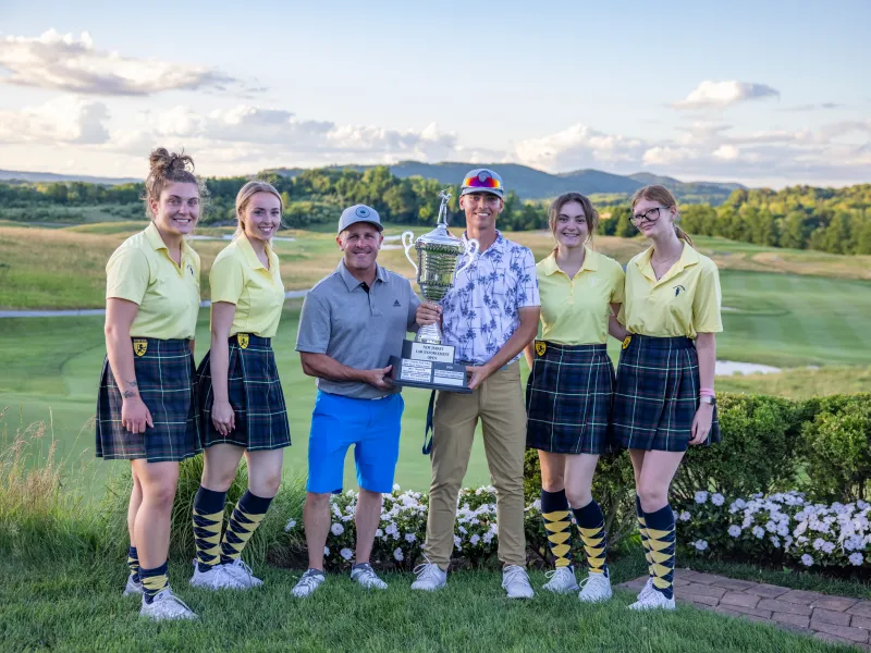 Two winners from the Law Enforcement Open 2022 standing with Ballyowen girls