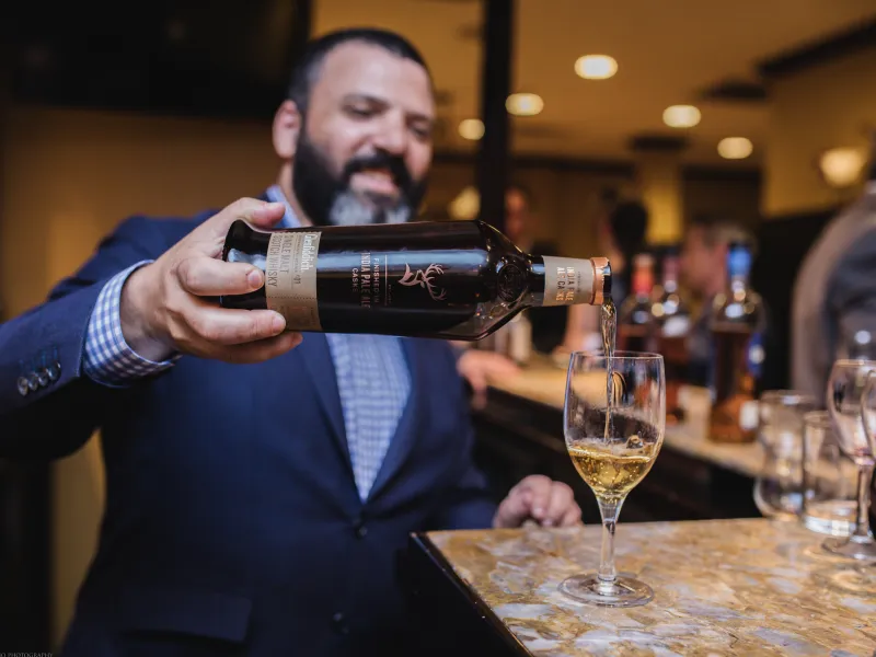 Pouring of white wine at NJ Wine and Food Festival 