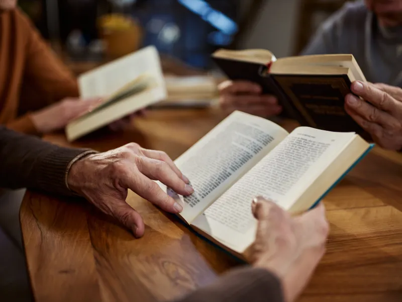 Person holding a book.