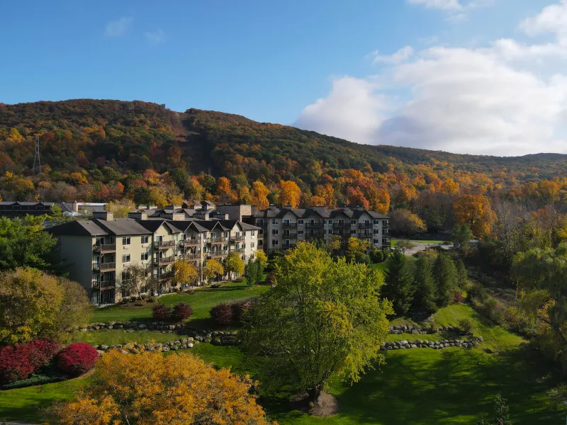Minerals Hotel sits in front of fall mountain range.